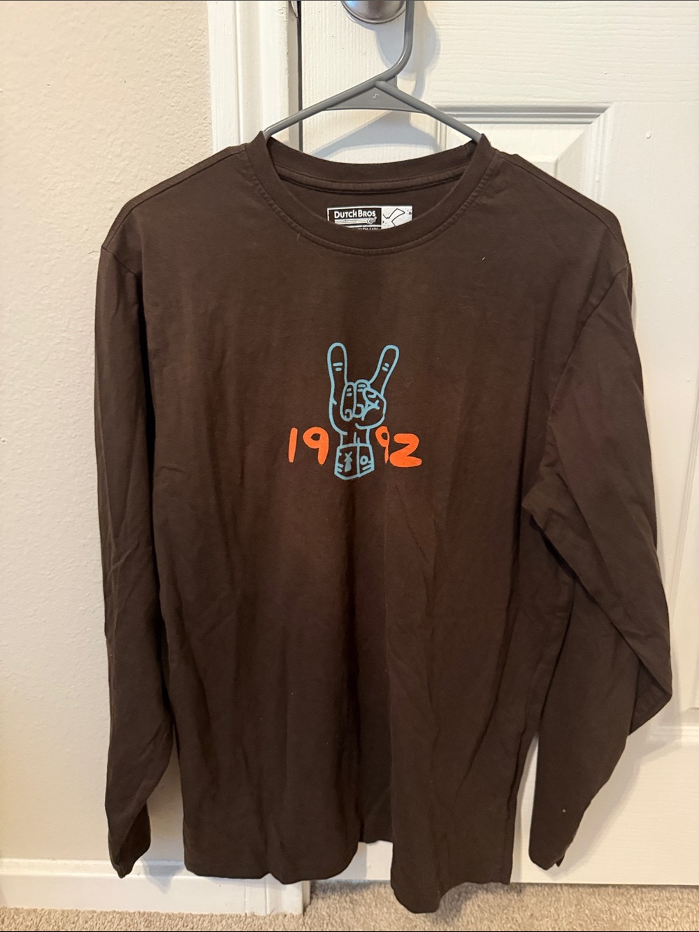 Dutch Bros Brown Long Sleeve Tee with Blue Hand and Orange Accents